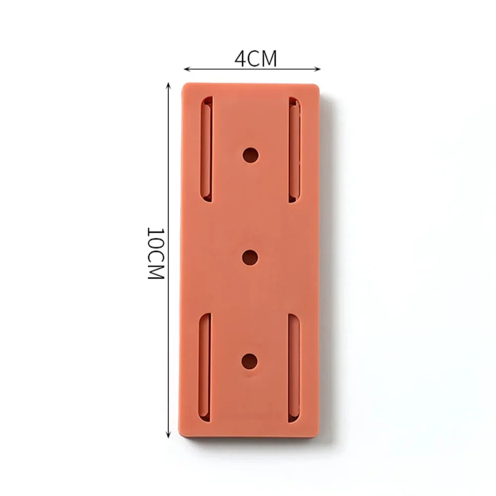 Support mural orange en silicone de 10x4 cm avec fentes et trous pour fixation